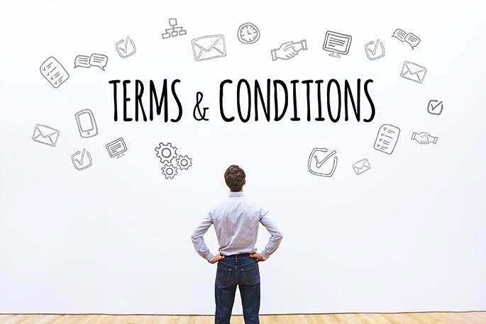 Picture of man looking at whiteboard with the phrase terms and conditions written on it to accompany a blog post about Uber terms of service changes