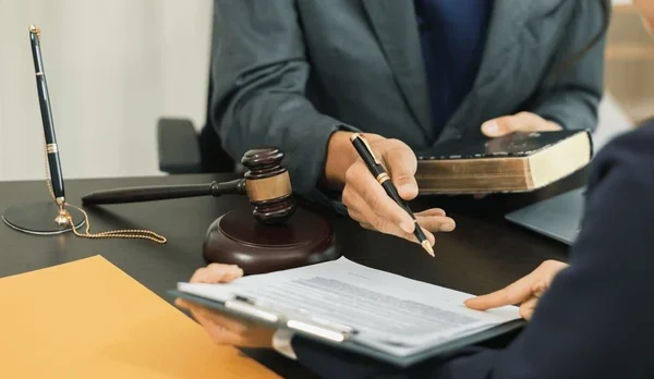 Lawyers reviewing a SaaS contract, symbolizing privacy, data security, and compliance.