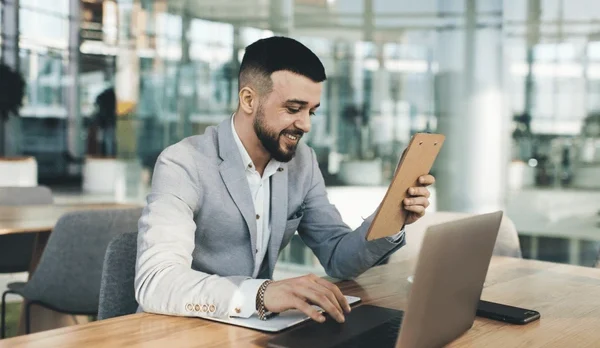Startup founder reviewing legal compliance documents online.